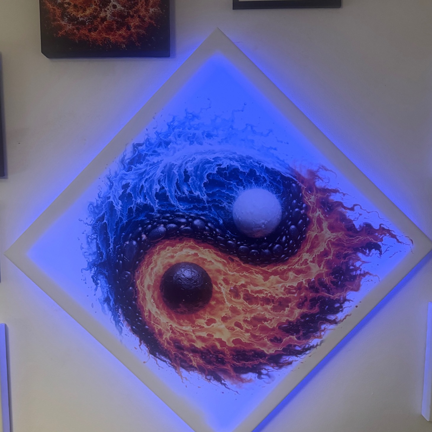 Fire and Water — The Inner Balance, installed as a diamond canvas with a blue LED halo